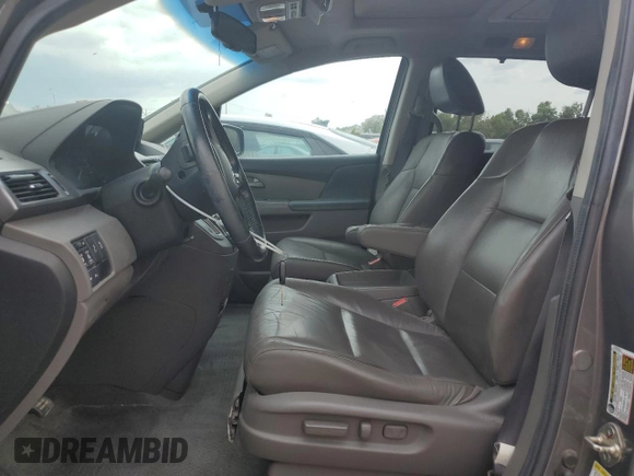 2012 Honda Odyssey Touring with VIN 5FNRL5H94CB102177, listed as a Copart auction lot 55942185 with 179,418 mi miles and Salvage Title. Bid and sale history available at DreamBid. Image 7.