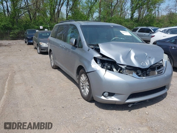 2014 Toyota Sienna XLE with VIN 5TDYK3DC9ES413283, listed as a IAAI auction lot 42091379 with 184,506 mi miles and . Bid and sale history available at DreamBid. Image 1.