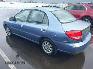 2003 Kia Rio with VIN KNADC125736227286, listed as a IAAI auction lot 41928174 with 151,431 mi miles. Bid and sale history available at carsss.com. Image 3.