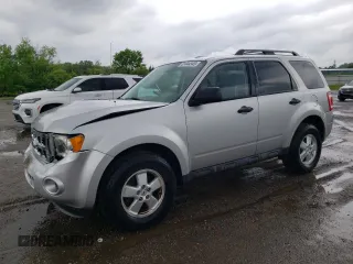 2010 Ford Escape XLS with VIN 1FMCU9C78AKD21851, listed as a Copart auction lot 61444945 with 70,404 mi miles and Clean title. Bid and sale history available at DreamBid. Image 1.