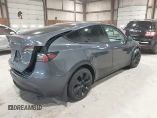 2023 Tesla Model Y Long Range with VIN 7SAYGAEE2PF755674, listed as a IAAI auction lot 41890025 with 24,783 mi miles and . Bid and sale history available at DreamBid. Image 4.