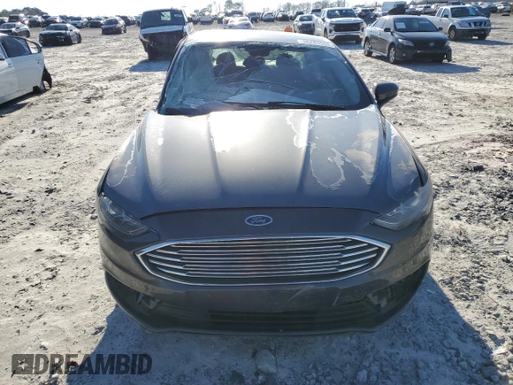 2017 Ford Fusion SE z VIN 3FA6P0H71HR150451, wystawiony jako Copart lot #46283505 z przebiegiem 148 702 mil mil oraz Szkoda całkowita • Salvage title. Historia ofert i sprzedaży dostępna na DreamBid. Obrazek 5.