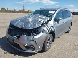 2021 Chrysler Pacifica Hybrid Touring L with VIN 2C4RC1L76MR594571, listed as a IAAI auction lot 40255745 with 58,163 mi miles and . Bid and sale history available at DreamBid. Image 6.