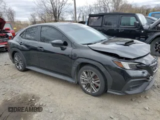 2023 Subaru WRX z VIN JF1VBAA65P9823639, wystawiony jako Copart lot #53605205 z przebiegiem 21 990 mil mil oraz Szkoda całkowita • Salvage title. Historia ofert i sprzedaży dostępna na DreamBid. Obrazek 4.