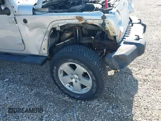 2012 Jeep Wrangler Unlimited Altitude z VIN 1C4HJWEGXCL120397, wystawiony jako IAAI lot #42219976 z przebiegiem 119 172 mil mil oraz . Historia ofert i sprzedaży dostępna na DreamBid. Obrazek 12.