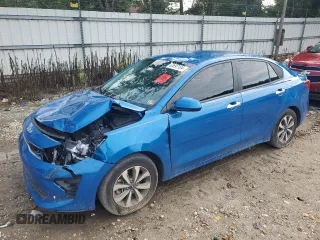 2023 Kia Rio S with VIN 3KPA24AD6PE548027, listed as a Copart auction lot 63697104 with 34,588 mi miles and Salvage Title. Bid and sale history available at carsss.com. Image 1.