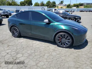 2022 Tesla Model Y Performance z VIN 7SAYGDEF2NF573979, wystawiony jako Copart lot #57778265 z przebiegiem 49 232 mil mil oraz Szkoda całkowita • Salvage title. Historia ofert i sprzedaży dostępna na DreamBid. Obrazek 4.