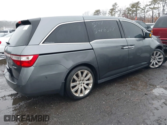 2012 Honda Odyssey Touring with VIN 5FNRL5H98CB089871, listed as a IAAI auction lot 41351447 with 999,999 mi miles. Bid and sale history available at carsss.com. Image 4.