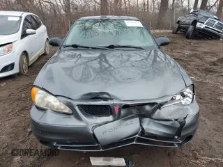 2004 Pontiac Grand Am SE with VIN 1G2NE52FX4M674634, listed as a IAAI auction lot 41547421 with 125,225 mi miles. Bid and sale history available at carsss.com. Image 12.