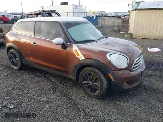 2014 MINI Cooper Paceman with VIN WMWSS1C58EWN94368, listed as a IAAI auction lot 41377194 with 56,897 mi miles. Bid and sale history available at carsss.com. Image 1.