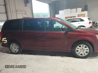2017 Dodge Grand Caravan SE z VIN 2C4RDGBG7HR865810, wystawiony jako IAAI lot #42414604 z przebiegiem 116 642 mil mil oraz . Historia ofert i sprzedaży dostępna na DreamBid. Obrazek 13.