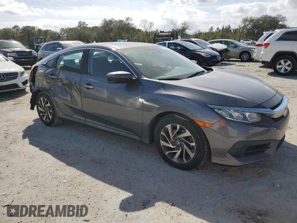 2018 Honda Civic EX with VIN 2HGFC2F79JH604565, listed as a Copart auction lot 47015045 with 99,029 mi miles and Salvage Title. Bid and sale history available at DreamBid. Image 4.
