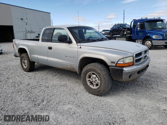 1999 Dodge Dakota SLT with VIN 1B7GG22Y2XS165166, listed as a Copart auction lot 47440435 with 167,345 mi miles and Salvage Title. Bid and sale history available at DreamBid. Image 4.
