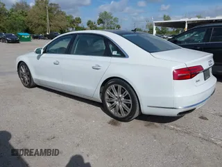 2015 Audi A8 L 4.0T with VIN WAU32AFD4FN002639, listed as a IAAI auction lot 41703951 with 103,722 mi miles. Bid and sale history available at carsss.com. Image 3.