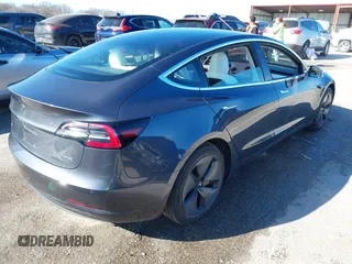 2018 Tesla Model 3 Long Range Battery with VIN 5YJ3E1EB6JF122167, listed as a IAAI auction lot 41761710 with 76,199 mi miles and . Bid and sale history available at DreamBid. Image 4.