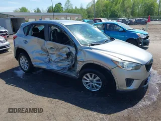 2013 Mazda CX-5 Sport z VIN JM3KE2BE8D0102903, wystawiony jako IAAI lot #42107096 z przebiegiem 150 643 mil mil oraz . Historia ofert i sprzedaży dostępna na DreamBid. Obrazek 1.