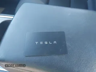 2023 Tesla Model Y Long Range z VIN 7SAYGAEE5PF603128, wystawiony jako IAAI lot #41328797 z przebiegiem 63 527 mil mil oraz . Historia ofert i sprzedaży dostępna na DreamBid. Obrazek 11.