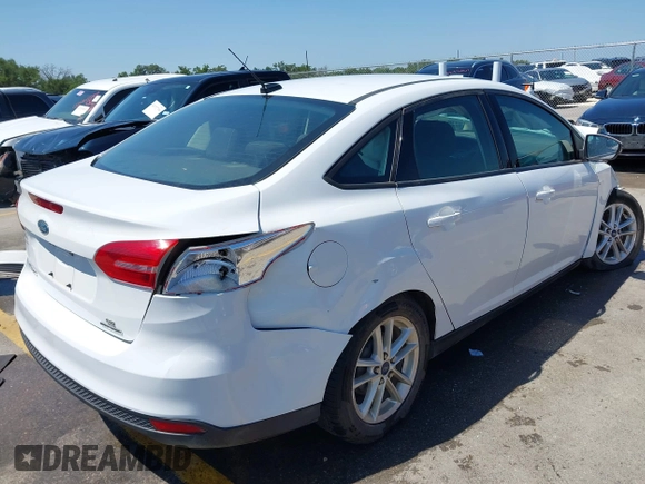 2016 Ford Focus SE z VIN 1FADP3F23GL338496, wystawiony jako IAAI lot #42333608 z przebiegiem 76 972 mil mil oraz . Historia ofert i sprzedaży dostępna na DreamBid. Obrazek 4.