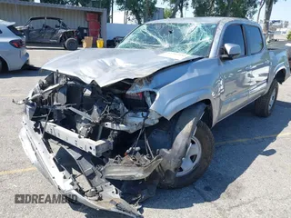 2018 Toyota Tacoma SR with VIN 5TFAX5GN2JX103685, listed as a IAAI auction lot 42392032 with 138,678 mi miles and . Bid and sale history available at DreamBid. Image 6.