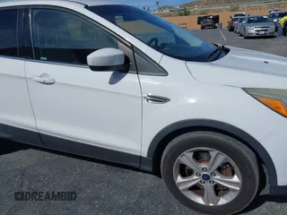 2014 Ford Escape SE with VIN 1FMCU9GX0EUD05633, listed as a IAAI auction lot 41582757 with 103,729 mi miles. Bid and sale history available at carsss.com. Image 6.