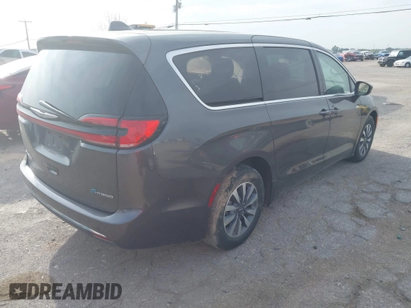 2023 Chrysler Pacifica Hybrid Touring L z VIN 2C4RC1L73PR598923, wystawiony jako IAAI lot #42124867 z przebiegiem 51 173 mil mil oraz . Historia ofert i sprzedaży dostępna na DreamBid. Obrazek 4.