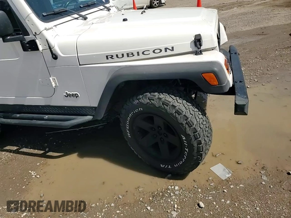 2003 Jeep Wrangler Rubicon z VIN 1J4FA69S73P333199, wystawiony jako Copart lot #50602615 z przebiegiem 133 254 mil mil oraz Szkoda całkowita • Salvage title. Historia ofert i sprzedaży dostępna na DreamBid. Obrazek 10.