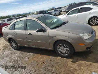 2005 Ford Focus S with VIN 1FAFP34NX5W263944, listed as a Copart auction lot 52973945 with 201,348 mi miles and Salvage Title. Bid and sale history available at carsss.com. Image 4.