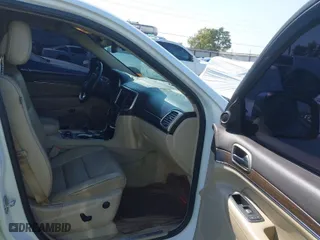 2014 Jeep Grand Cherokee Overland with VIN 1C4RJFCTXEC128443, listed as a IAAI auction lot 40512681 with 126,379 mi miles. Bid and sale history available at carsss.com. Image 5.