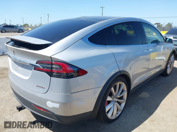 2016 Tesla Model X P90D with VIN 5YJXCAE49GF001067, listed as a IAAI auction lot 41980455 with 94,746 mi miles. Bid and sale history available at carsss.com. Image 4.