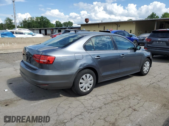 2015 Volkswagen Jetta S with VIN 3VW2K7AJ5FM327788, listed as a Copart auction lot 64034985 with 43,172 mi miles and Salvage title. Bid and sale history available at DreamBid. Image 3.