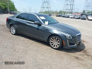 2015 Cadillac CTS Luxury AWD z VIN 1G6AX5SX9F0118017, wystawiony jako IAAI lot #42157949 z przebiegiem 128 078 mil mil oraz . Historia ofert i sprzedaży dostępna na DreamBid. Obrazek 1.