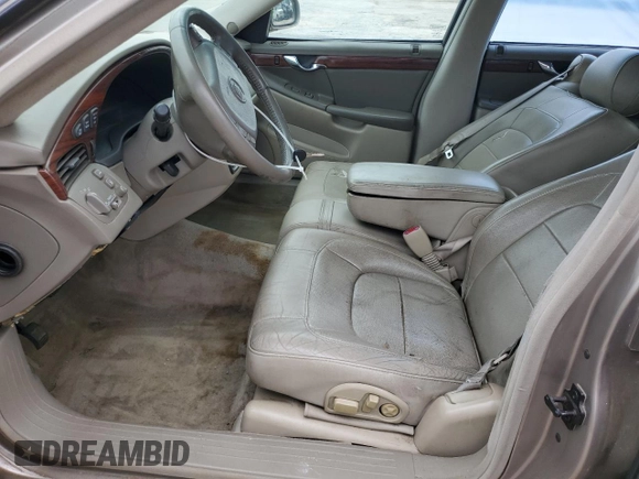 2004 Cadillac DeVille z VIN 1G6KD54Y64U134605, wystawiony jako Copart lot #56258215 z przebiegiem 256 662 mil mil oraz Szkody całkowita. Historia ofert i sprzedaży dostępna na DreamBid. Obrazek 7.