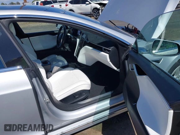 2016 Tesla Model S 90D with VIN 5YJSA1E22GF174637, listed as a IAAI auction lot 42234083 with 142,915 mi miles and . Bid and sale history available at DreamBid. Image 5.