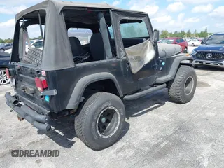 1994 Jeep Wrangler S with VIN 1J4FY19P7RP418580, listed as a IAAI auction lot 41899026 with 196,430 mi miles. Bid and sale history available at carsss.com. Image 4.