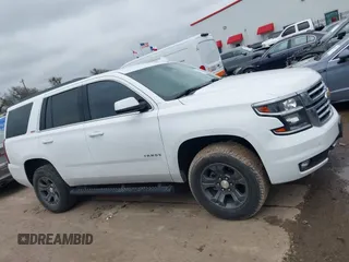 2017 Chevrolet Tahoe LT with VIN 1GNSKBKC1HR401044, listed as a IAAI auction lot 41573362 with 103,865 mi miles and . Bid and sale history available at DreamBid. Image 13.