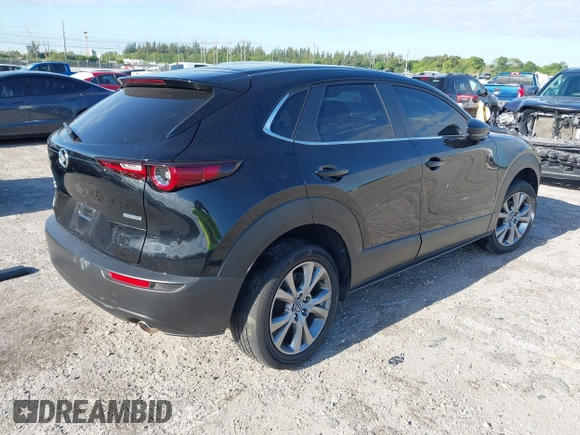 2023 Mazda CX-30 S Select with VIN 3MVDMBBM9PM508958, listed as a IAAI auction lot 42009029 with 21,219 mi miles and . Bid and sale history available at DreamBid. Image 4.