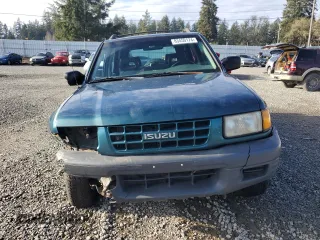1999 Isuzu Rodeo S with VIN 4S2CM58W7X4359649, listed as a Copart auction lot 83450174 with 171,940 mi miles and Salvage title. Bid and sale history available at DreamBid. Image 5.