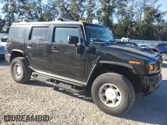 2003 Hummer H2 with VIN 5GRGN23UX3H136571, listed as a Copart auction lot 80823054 with 220,003 mi miles and Salvage Title. Bid and sale history available at carsss.com. Image 4.