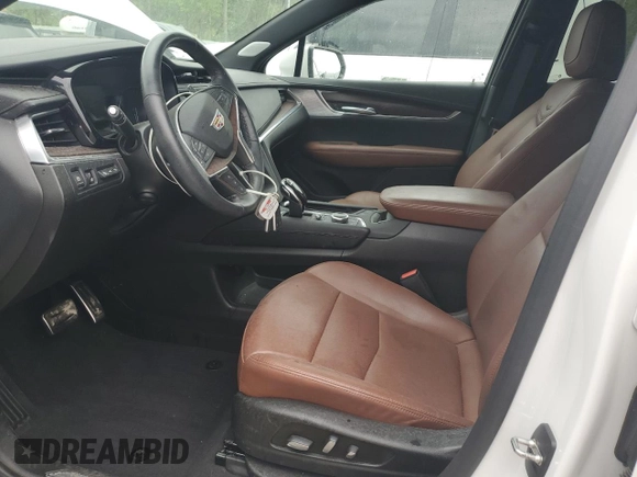 2023 Cadillac XT5 AWD Sport with VIN 1GYKNGRS4PZ176086, listed as a Copart auction lot 53955535 with 15,709 mi miles and Salvage title. Bid and sale history available at DreamBid. Image 7.