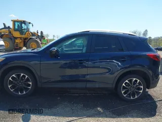 2016 Mazda CX-5 Grand Touring with VIN JM3KE4DY5G0681369, listed as a IAAI auction lot 42102805 with 128,182 mi miles and . Bid and sale history available at DreamBid. Image 14.