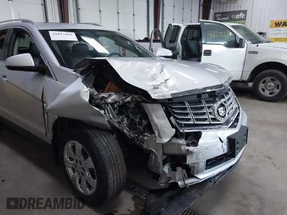 2014 Cadillac SRX Luxury Collection z VIN 3GYFNEE36ES679505, wystawiony jako IAAI lot #41817608 z przebiegiem 62 351 mil mil oraz . Historia ofert i sprzedaży dostępna na DreamBid. Obrazek 6.
