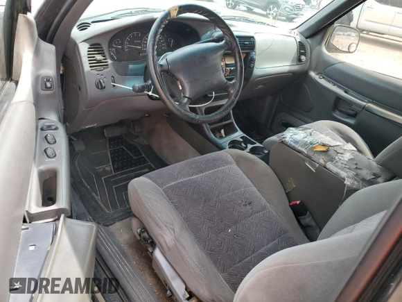 1999 Ford Explorer Sport z VIN 1FMYU22X9XUC03819, wystawiony jako Copart lot #69840564 z przebiegiem 214 315 mil mil oraz Szkoda całkowita • Salvage title. Historia ofert i sprzedaży dostępna na DreamBid. Obrazek 8.