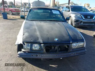 1997 BMW 3-Series 328IC with VIN WBABK8323VET99072, listed as a IAAI auction lot 40669447 with 135,584 mi miles. Bid and sale history available at carsss.com. Image 13.