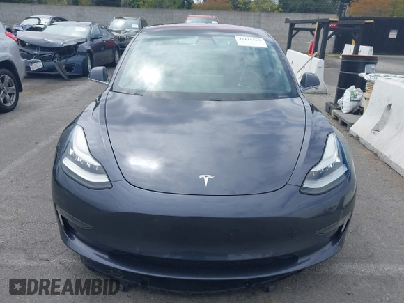 2018 Tesla Model 3 Long Range Battery with VIN 5YJ3E1EA8JF059385, listed as a IAAI auction lot 42116589 with 63,630 mi miles and . Bid and sale history available at DreamBid. Image 13.