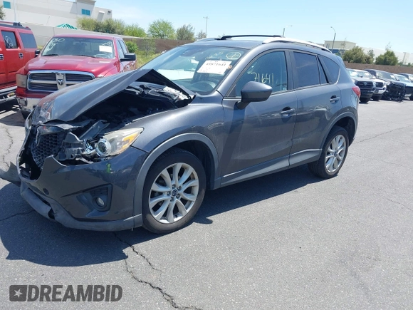 2014 Mazda CX-5 Grand Touring with VIN JM3KE4DY8E0391317, listed as a IAAI auction lot 41871641 with 77,048 mi miles. Bid and sale history available at carsss.com. Image 2.