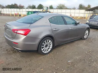 2014 Maserati Ghibli with VIN ZAM57XSA9E1082923, listed as a IAAI auction lot 41110273 with 91,551 mi miles. Bid and sale history available at carsss.com. Image 4.