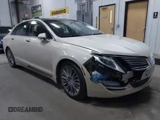 2015 Lincoln MKZ Hybrid z VIN 3LN6L2LU1FR604978, wystawiony jako IAAI lot #41594407 z przebiegiem 165 148 mil mil oraz . Historia ofert i sprzedaży dostępna na DreamBid. Obrazek 1.