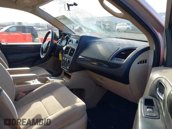 2014 Dodge Grand Caravan SXT with VIN 2C4RDGCG0ER210186, listed as a IAAI auction lot 40813319 with 100,230 mi miles and . Bid and sale history available at DreamBid. Image 5.