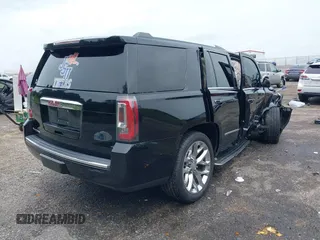 2016 GMC Yukon Denali with VIN 1GKS1CKJXGR254306, listed as a IAAI auction lot 39953539 with 164,149 mi miles. Bid and sale history available at carsss.com. Image 4.