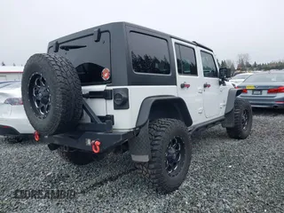 2014 Jeep Wrangler Unlimited Sahara with VIN 1C4BJWEG1EL127232, listed as a IAAI auction lot 41847368 with 109,975 mi miles. Bid and sale history available at carsss.com. Image 4.